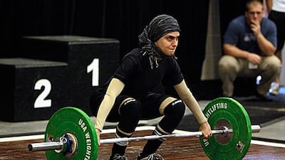 Kulsoom Abdullah competes during the US weightlifting championships where she was able to wear a hijab in competition.