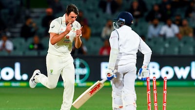Australia's Pat Cummins celebrates after bowling India's Prithvi Shaw during the second day of the first Test in Adelaide on Friday. AFP