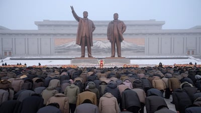 Pyongyang residents bow before the statues of late North Korean leaders Kim Il Sung and Kim Jong Il during National Memorial Day on Mansu Hill in Pyongyang. AFP