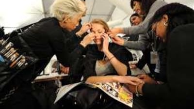 A model is made up backstage before the showing of the fall 2009 collection of Georges Chakra.