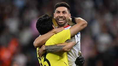 Bono celebrates with Gonzalo Montiel, who struck the winning penalty for Sevilla. AFP