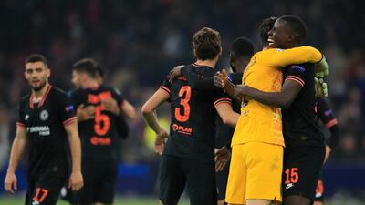 Kurt Zouma, right embraces goalkeeper Kepa Arrizabalaga as they celebrate the win over Ajax. AP Photo