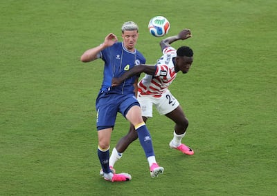 Folarin Balogun fouls Tarik Muharemovic of Bosnia and Herzegovina. Getty Images via AFP