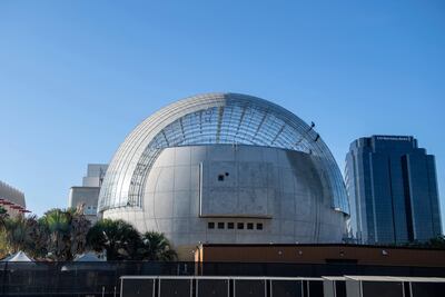 Workers clean the roof of the new Academy Museum of Motion Pictures amid the coronavirus pandemic. The museum was set to open in April 2021. AFP