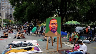 People gather in a park near city hall that has become the site of an Occupy City Hall protest in New York. EPA