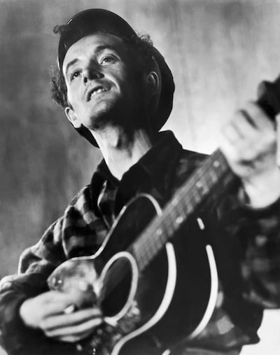 American folk singer and composer Woody Guthrie released This Land Is Your Land in 1940. Getty Images