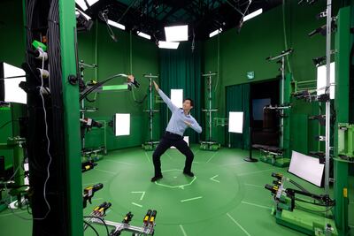 A journalist poses for a 360-degree image during a demonstration to create a 3D avatar at the Jump Studio in the SK Telecom headquarters in Seoul. Bloomberg