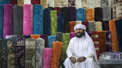 Noorullah Khan, one of the oldest carpet sellers in Abu Dhabi, counts the late Sheikh Zayed among his customers over the last three decades. Very few know that the carpet market on Mina Zayed is one of the oldest markets in the capital. Mona Al Marzooqi / The National