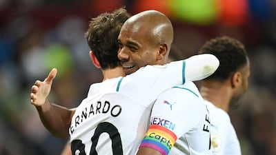 Fernandinho of Manchester City congratulates teammate Bernardo Silva. Getty