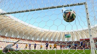 The ball enters the net from Mile Jedinak's successful penalty conversion to put Australia 2-1 up against Netherlands on Wednesday at the 2014 World Cup in Porto Alegre, Brazil. Cameron Spencer / Getty Images