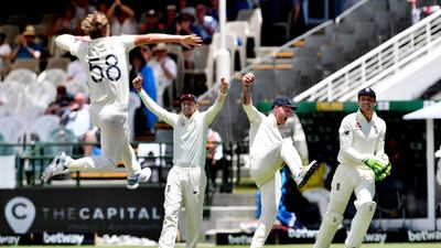 Ben Stokes, second right, after taking the catch to dismiss Pieter Malan. Getty