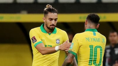 Brazil's Neymar with Alex Telles after the match. Reuters