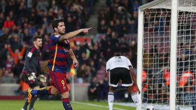 Luis Suarez reacts after scoring against Valencia. Manu Fernandez / AP Photo