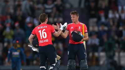 England’s Eoin Morgan (L) and Jos Buttler celebrate winning the match. (Reuters/Matthew Childs)