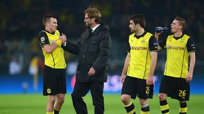 Jurgen Klopp celebrates Borussia Dortmund's victory with Kevin Grosskreutz, left, on Wednesday night. Lars Baron / Bongarts / Getty Images / March 19, 2014