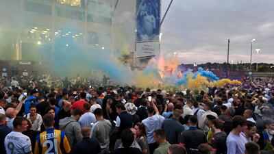 Leeds United supporters gather outside their Elland Road ground to celebrate the club's return to the Premier League after a gap of 16 years. AFP