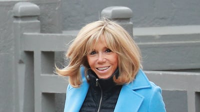 Brigitte, wearing black jeans, a black jacket and blue coat with gloves, during her visit to Le Touquet on March 15, 2020. AFP