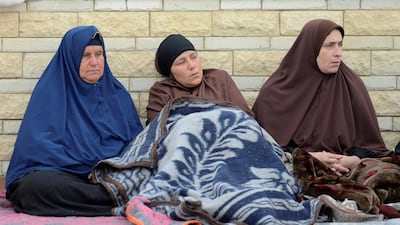 Relatives of victims of the explosion wait outside Suez Canal University hospital. Reuters