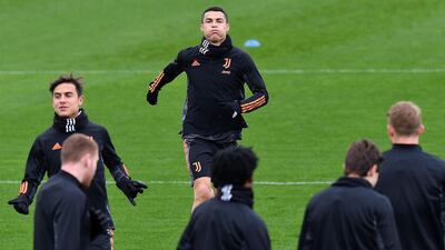 uventus' Argentine forward Paulo Dybala and Cristiano Ronaldo during training ahead of their Champions League match against Barcelona. AFP