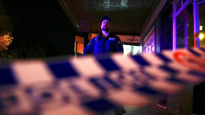 A policeman stands on a street that has been blocked to the public after Australian counter-terrorism raids. Reuters / David Gray