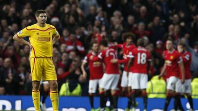 Liverpool's Steven Gerrard reacts after Manchester United's third goal in his side's 3-0 loss in the Premier League on Sunday. Phil Noble / Reuters