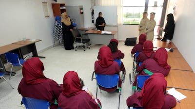 Prisoners listen to a teacher during a class at Dubai Female Prison in Al Awir. Chris Whiteoak/The National