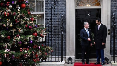 UK Prime Minister Keir Starmer receives Qatar's Emir Sheikh Tamim outside No 10 Downing Street in central London. AFP