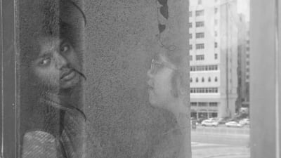Vidhyaa Chandramohan's children by the window of their Abu Dhabi apartment. Vidhyaa Chandramohan