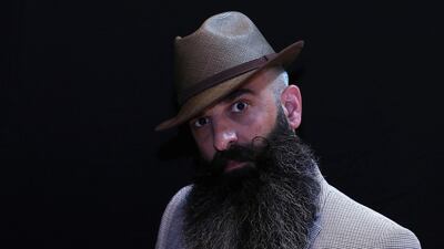 A participant of the international World Beard and Moustache Championships poses before taking part in one of the 17 categories of beard and moustache styles competing in Antwerp, Belgium. Reuters