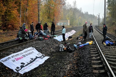 Activists block the railway tracks to a coal-fired power plant to protest against mining in western Germany. EPA