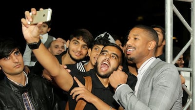Actor Michael B Jordan with fans as he attends the Bilal premiere during day two of the 12th annual Dubai International Film Festival. Neilson Barnard / Getty Images for DIFF