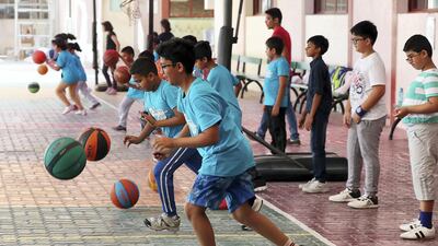 Pupils at the Indian High School's basketball summer camp in Dubai. Pawan Singh / The National