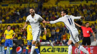 Karim Benzema, left, celebrates with his teammate Gareth Bale after scoring Real Madrid’s second goal. David Ramos / Getty Images