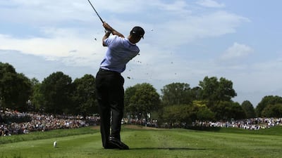Tiger Woods tees off on the eighth hole during the first round of the 91st PGA Championship at the Hazeltine National Golf Club in Chaska, Minnesota., Thursday, August 13, 2009. Charlie Riedel / AP Photo