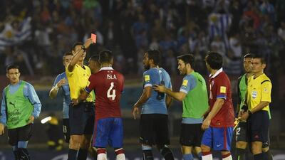 Jorge Valdivia, right, is shown the red card during Chile's defeat to Uruguay. Pablo Porcuincula / AFP