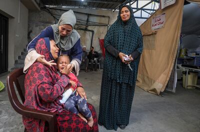 Palestinians mourn relatives killed by Israeli bombardment in the Gaza Strip, at a hospital in Rafah. AP