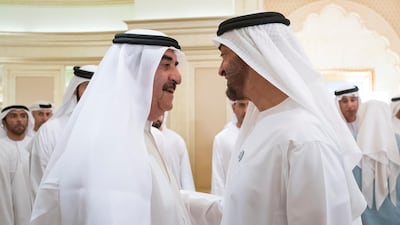 Sheikh Saud bin Rashid Al Mualla, Ruler of Umm Al Quwain, left, with Crown Prince of Abu Dhabi Sheikh Mohamed bin Zayed earlier this year, will double salaries for government employees. Ryan Carter for the Crown Prince Court - Abu Dhabi