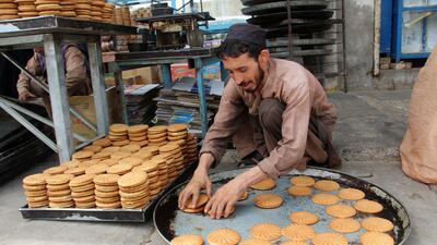A vendor prepares traditional sweets in Kandahar, southern Afghanistan, before Eid Al Adha. EPA