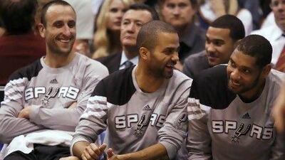 Manu Ginobili, left, Tony Parker, centre, and Tim Duncan will have few days to relax before their next play-off series against either the Los Angeles Clippers or the Memphis Grizzlies.