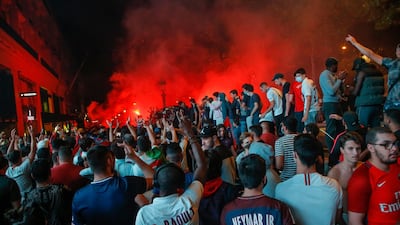The Champs Elysee comes alive with PSG fans. AP