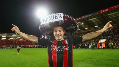 Ryan Fraser of Bournemouth celebrates victory on the pitch after the club secured promotion to the Premier League on Monday night. Clive Rose / Getty Images