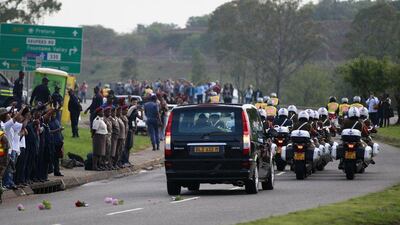Military outriders escort the funeral cortege. Thomas Mukoya / Reuters