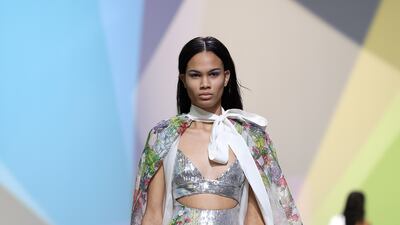 Blooms in fresh yellows, greens and pinks on silver at the Elie Saab womenswear spring/summer 2023 show. Getty