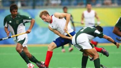 Barry Middleton of Great Britain fights for a ball Zeeshan Ashraf of Pakistan.