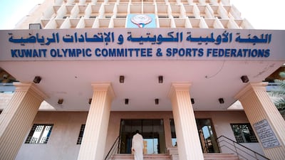 A Kuwaiti man enters the Kuwait Olympic Committee and Sports Federation building in Kuwait City. The International Olympic Committee lifted a ban on Kuwait, allowing the Gulf state to take part in the Asian Games in Jakarta. AFP