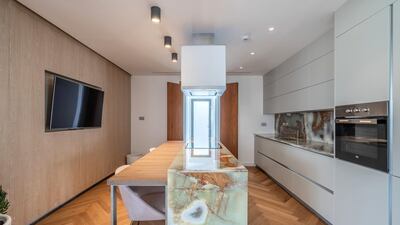 The kitchen comes with high-end stainless steel appliances.