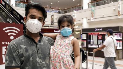 Kaashvi goes around with her father with a face mask on in Al Wahda Mall, Abu Dhabi. Victor Besa /The National