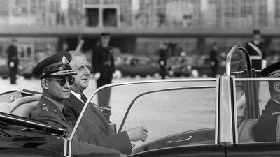 The king, left, riding with French president Charles de Gaulle upon his arrival at Orly airport, south of Paris on October 11, 1960. AFP