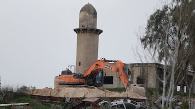 An Israeli bulldozer prepares a road at the evacuated settlement of Sanur, near the West Bank city of Jenin, on February 10. EPA