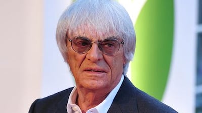 Bernie Ecclestone says he will continue to run Formula One's day to day affairs despite stepping down from as the director of the holding company that controls the series until the conclusion of his trial on bribery charges in a Munich court. AFP PHOTO/CARL COURT